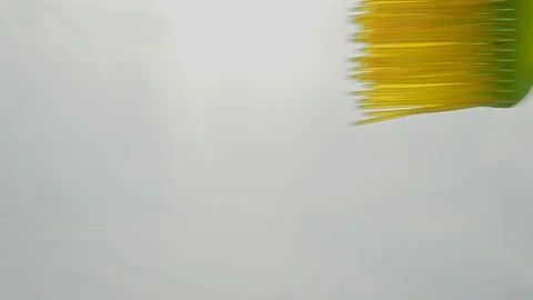 View from below as a cooking brush smears ketchup with herbs for cooking steak Stock Footage 122621835