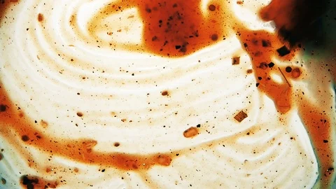 View from below as a cooking brush smears ketchup with herbs for cooking steak Stock Footage 122629988
