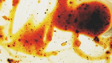 View from below as a cooking brush smears ketchup with herbs for cooking steak Stock Footage 122634268