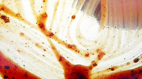 View from below as a cooking brush smears ketchup with herbs for cooking steak Stock Footage 122637325