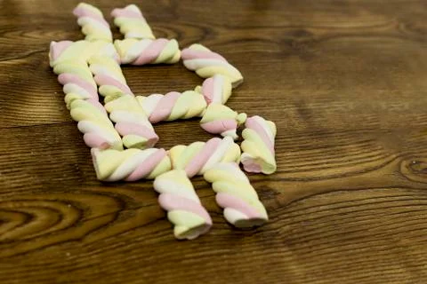 View from below at drawn the symbol with marshmallows. Stock Photos