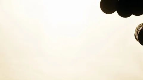 View from below as the hand throws gold coins. Moves them, collects them in the Stock Footage 122608550