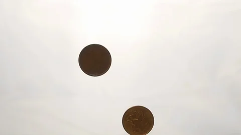 View from below as the hand throws gold coins. Moves them, collects them in the Stock Footage 122611199