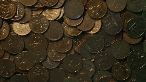 View from below as the hand throws gold coins. Moves them, collects them in the Stock Footage 122611706