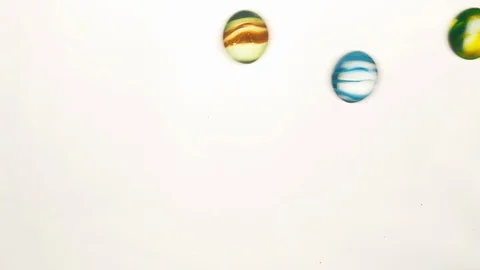 View from below as the hand throws small multi-colored colored plastic balls Stock Footage 122596798