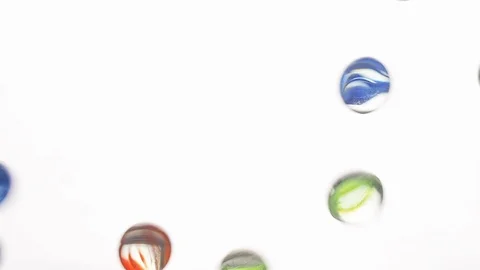 View from below as the hand throws small multi-colored colored plastic balls Stock Footage 122597615