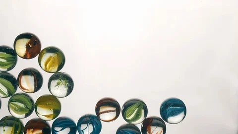 View from below as the hand throws small multi-colored colored plastic balls Stock-Footage 122600179