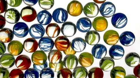 View from below as the hand throws small multi-colored colored plastic balls Stock Footage 122602764