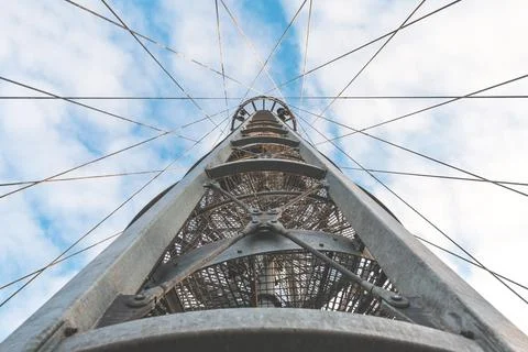 View from below on the metal structure of the lookout tower. Modern urban Stock Photos