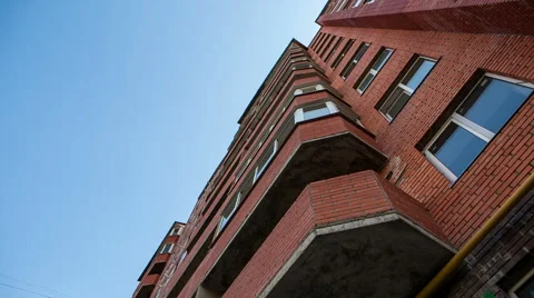 View from below at red apartment building Stockbeeldmateriaal 40561185