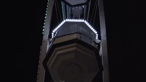 View from below of a rotating Ferris wheel. Stock Footage 99309839