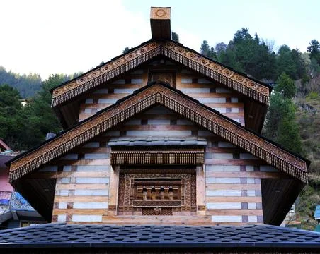 View from below of the side of a temple made of mixed material and displayi.. Stock Photos