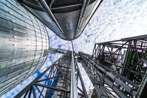 View from below on steel grain elevators. Modern up to date factory. Selectiv Stock Photos