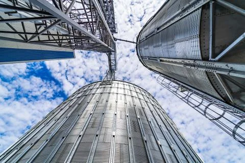 View from below on steel grain elevators. Modern up to date factory. Selectiv Stock Photos