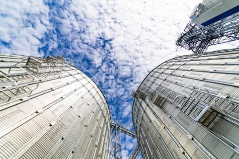 View from below on steel grain elevators. Modern up to date factory. Selectiv Stock Photos