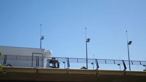 View from below. Truck Passing on the Bridge. Slow Motions. 4K Stock Footage 287588737