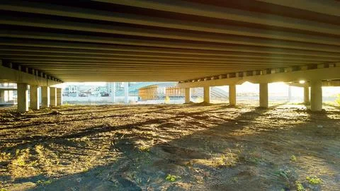 View from below under a wide overpass at sunset Foto stock