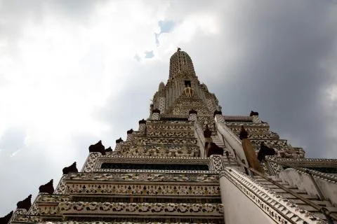 View from below of the Wat Arun temple at Bangkok with the sky in the backgro Stock Photos