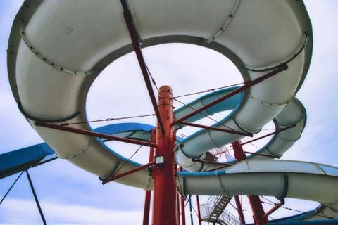 View from below a water slide looking up through the built structure Stock Photos