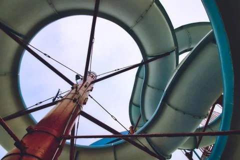 View from below a water slide looking up through the built structure Stock Photos
