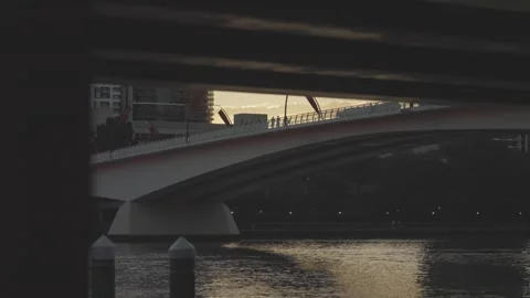 View Beneath a Stone Arched Bridge at Dusk Stockbeeldmateriaal 345051179