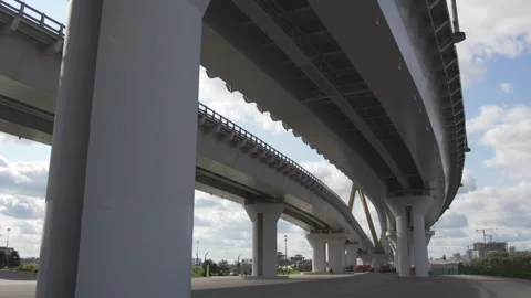 View from beneath transport bridge supported by columns Stock Footage 327804340