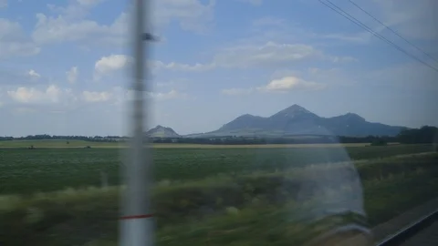 View of Beshtau mountain from moving train window outside Pyatigorsk Russia Stock Footage 122444357