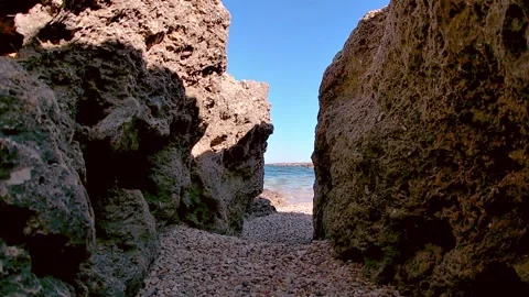 View between the rocks of the sea Stock Footage 133636416