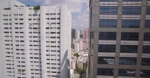 View Between Two Tower Blocks In Downtown Bangkok, Thailand, Aerial Ascending Video stock 80242336