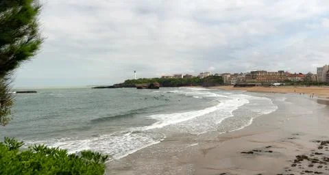 View of Biarritz beach under cloudy sky Stock Photos