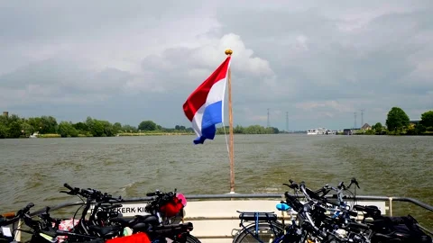 View of bicycles at the back of a ferry and the dutch flag Stock Footage 302900158