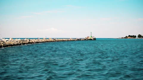 View to the big breakwater surrounded by sea and with signal light. Video stock 152956341