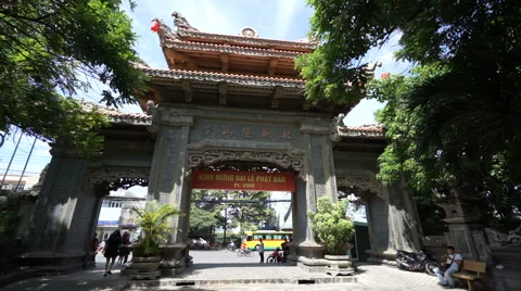 View to big Buddhist gate with high columns and street on the background at Stock Footage 67420890
