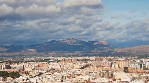 View Of A Big City Downtown, Distant Mountains And Cloudy Sky Stock Footage 229165644