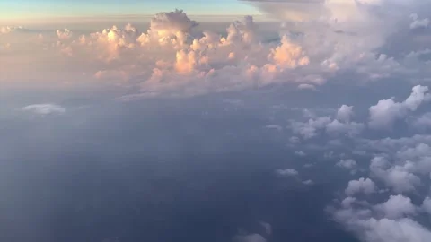 View Of Big Clouds Fluffy From The Plane Window During the Sunrise Vídeo Stock 251383835