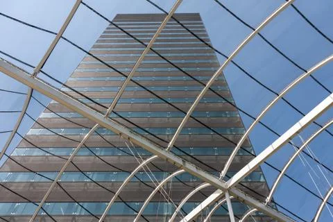 View at a big office building from within the entrance hall with glass roof Stock Photos