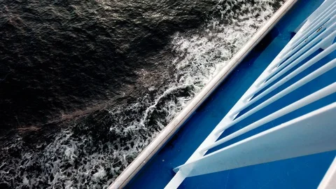 View of a big ship hull making waves from beneath it. Stock Footage 118930228