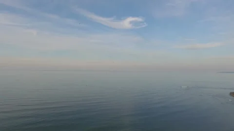 View from bird flight over the ocean and the island of Sakhalin Stock Footage 54107839