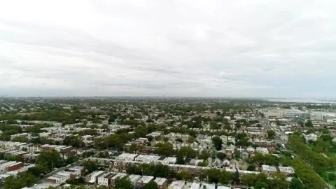 View of Birds Flying High Over a Brooklyn Neighborhood Vídeos de archivo 146107571