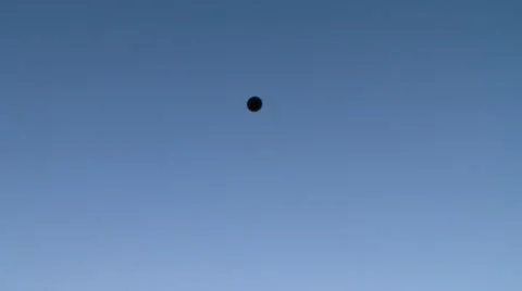 View of black balloon rotates in sky Stock Footage 46522540