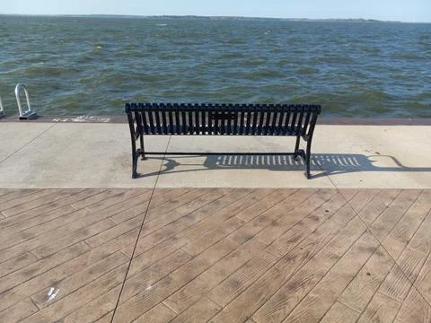 View of Black Bench by the Lake Stock Photos