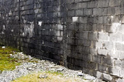 View of a black brick wall at an angle. Background Foto stock