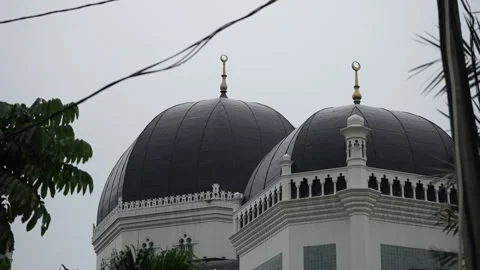 View of the black mosque dome against a cloudy sky background Stock Footage 259004193