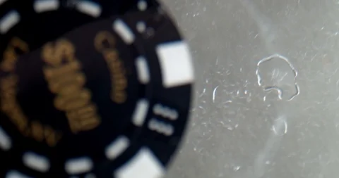 View of black poker chip under water Stock Footage 112330648