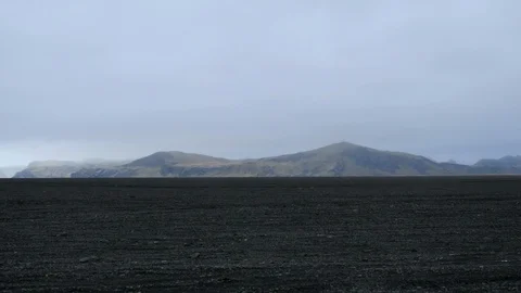 View of a black sand desert from the window of a car in Iceland, Europe Stock Footage 93260088