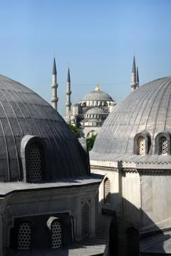 View at Blue Mosque from Hagya Sofia, two big cupolas at foreground. Stock Photos