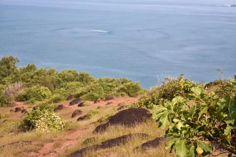 View of the blue ocean just below the mountain Stock Photos
