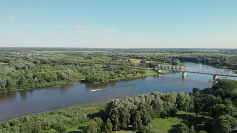 View of the blue river spilling between green fields and forests. Stock Footage 170566519