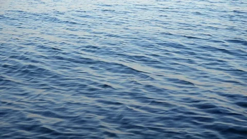 View of blue sea at sunset. Close up of seawater waves splashing. Slow motion of Video stock 114819071