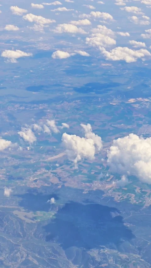 View of the blue sky above the clouds from the airplane window. Air travel. Video stock 310230649
